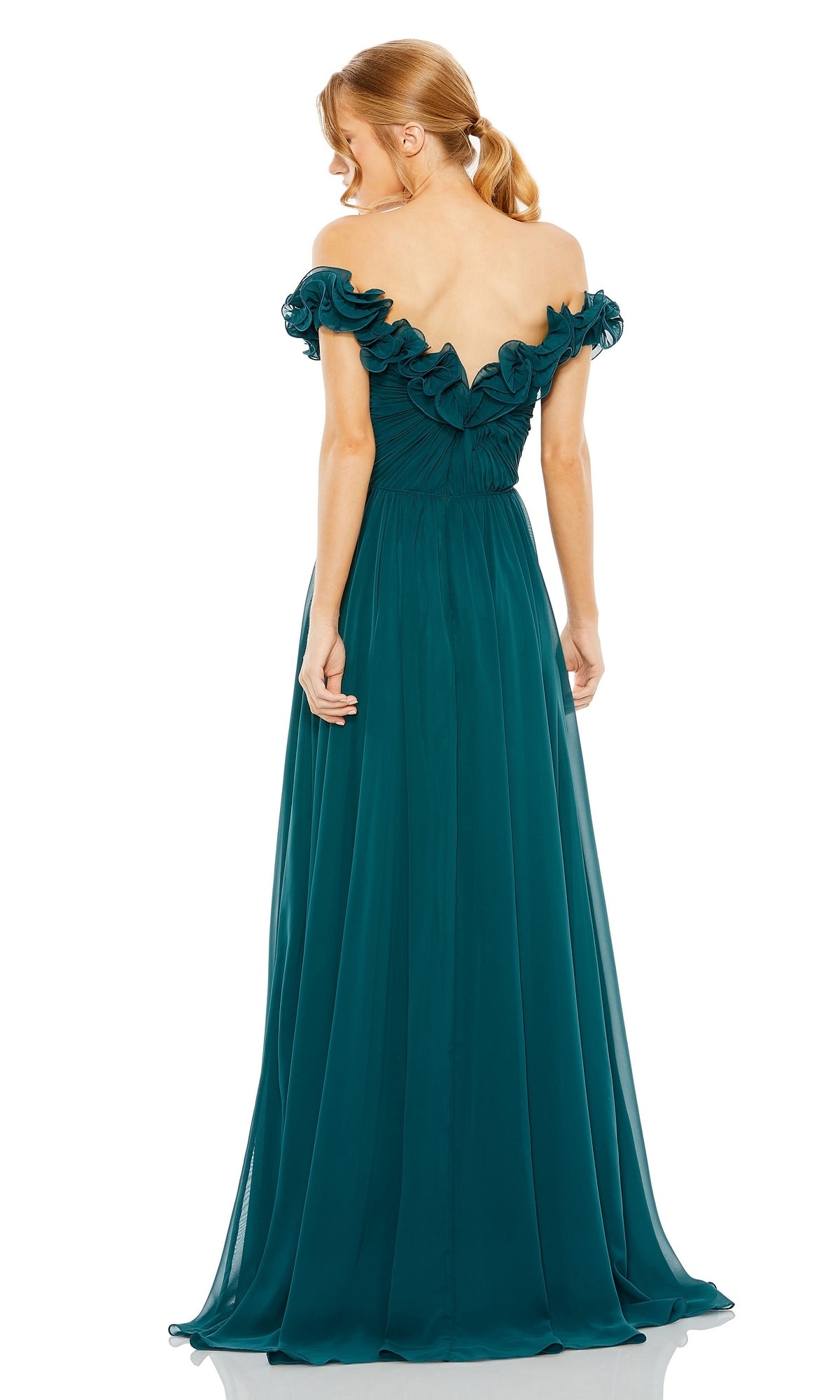 Woman in the Long Formal Dress 11591 by Mac Duggal, a floor-length gown with an off-the-shoulder neckline, ruched bodice, and ruffled detailing, standing and facing away from the camera.